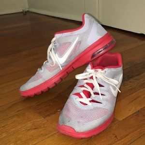 Grey and red nike tennis shoes